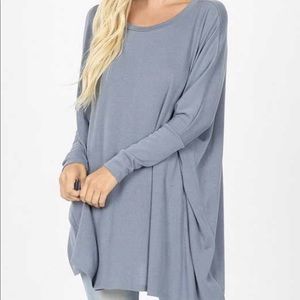 Dolman sleeve top with pockets.